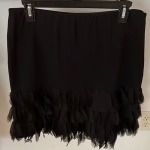 This unique skirt is has three rows of soft-flowing trim.